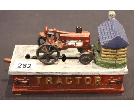 Cast iron tractor moneybox. P&amp;P Group 2 (£18+VAT for the first lot and £3+VAT for subsequent lots) 