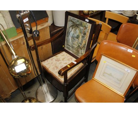 A bar back commode chair