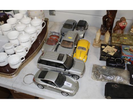 A quantity of model cars including Porsche, Audi, Range Rover, VW Beetle etc