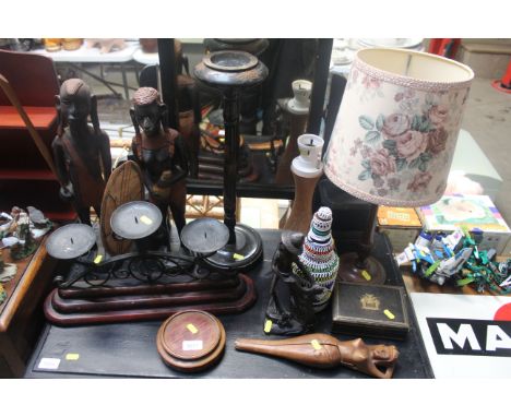 A quantity of various wooden items to include smokers stand, table lamp with shade, carved figure of a fisherman, nutcracker 