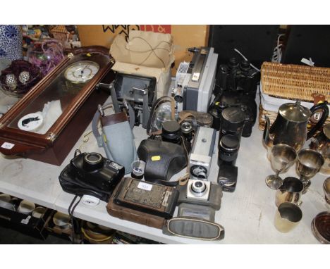 A quantity of cameras, binoculars, projector etc.