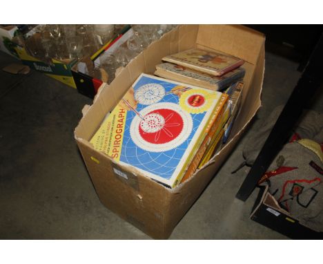 A box containing a Spirograph, various other toys, vintage books etc.