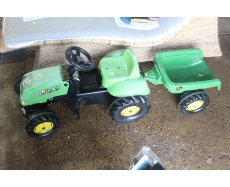 A child's pedal tractor and trailer 