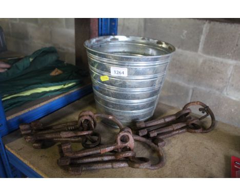 A small metal bucket and three sets of large vintage keys