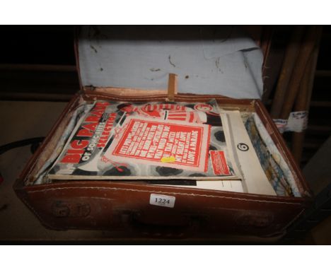 A vintage suitcase containing various sheet music etc.