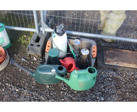 Three plastic watering cans, various bird feeders, Hozelock manual spray bottle etc