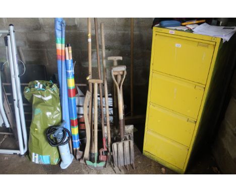 A quantity of tools to include digging fork and spade, felling axe, garden hoe etc.