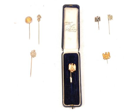 Seven tie pins of Napoleon interest, six white a yellow metal pins displaying the French Imperial Eagle, a vintage tie pin bo