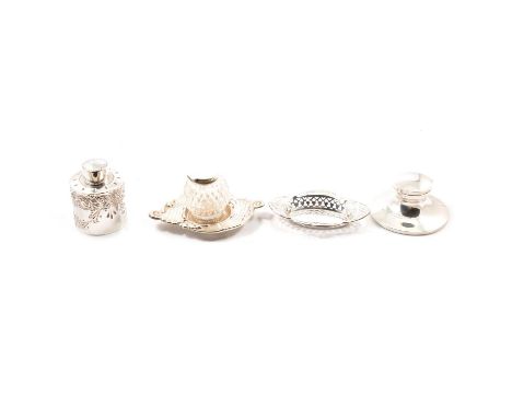 Two silver inkwells, including a small capstan inkwell, personal engraving, marks rubbed, 10cm diam; the second with cut glas