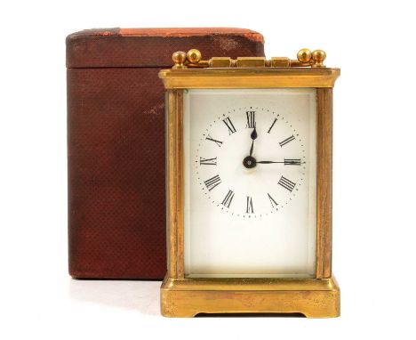 Brass carriage clock, white dial with Roman numerals, 11.5cm, with leather carrying case.