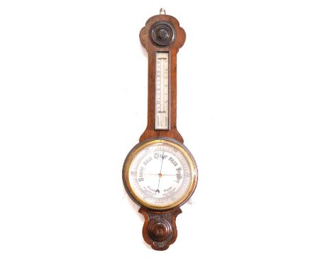 Oak cased aneroid barometer with thermometer, carved case, silvered dials, 79cm.