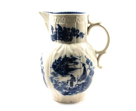 Caughley blue and white press-moulded cabbage-leaf mask jug, Fisherman pattern, rim chip, 22cm.Qty: 1Condition report:There a