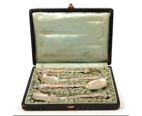 Set of four Continental silver serving utensils, rococo handles with engraved initials, including one fork and three spoons, 