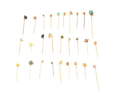 Twenty-eight tie pins, a gold prospectors nugget set on a yellow metal pin testing as gold, 3.3g; a small bean marked 15ct se