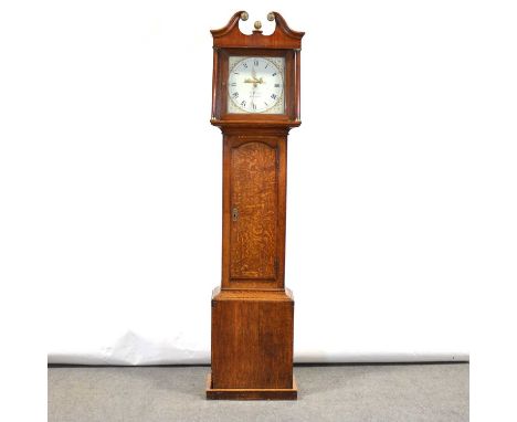 Oak longcase clock, the hood with swan neck pediment, turned columns, trunk with long door, plinth base (adapted), twelve inc