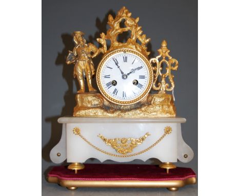 A late 19th century French gilt metal mantel clock, having enamelled dial with Roman numerals, surmounted by a musician, on a