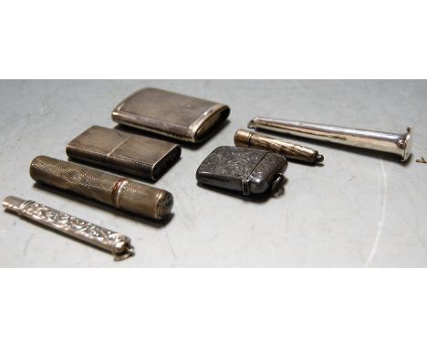 A late Victorian silver vesta having all over foliate engraved decoration and vacant cartouche together with engine turned si