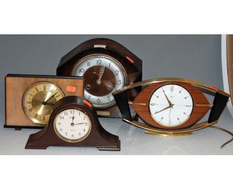 A 1950s oak cased mantel clock; together with three others (4)