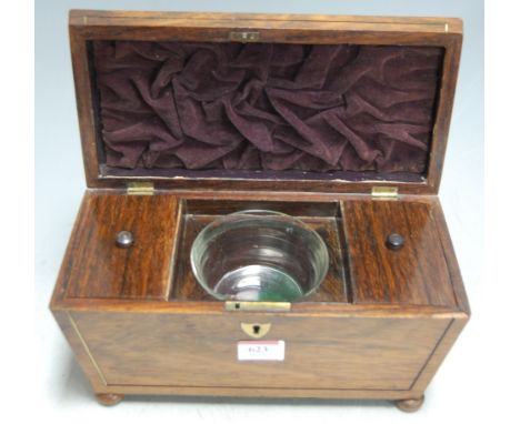 A late Regency rosewood and brass inlaid tea caddy, of sarcophagus form