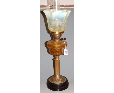 A Victorian pedestal oil lamp, having vaseline glass shade to clear glass font on brass pedestal base, height 61cm (excluding