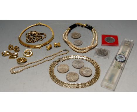 A collection of miscellaneous items to include a Swatch team wrist watch, commemorative crowns, beaded necklaces etc