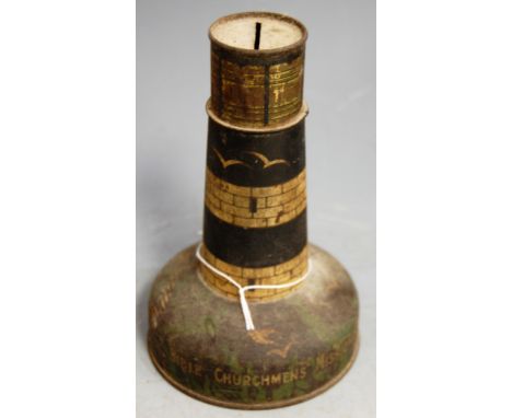 An early 20th century lithograph printed novelty moneybox in the form of a lighthhouse, printed bible Churchmens Missionary S