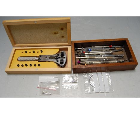 A collection of assorted watchmaker's tools to include watchback opener, steel pins etc