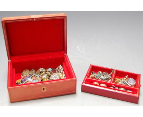 A red leather clad jewellery box the contents to include Scottish white metal and hardstone inset brooch in the form of a har