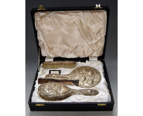 A cased silver four-piece dressing table set, comprising hairbrush, clothes brush, hand mirror and comb