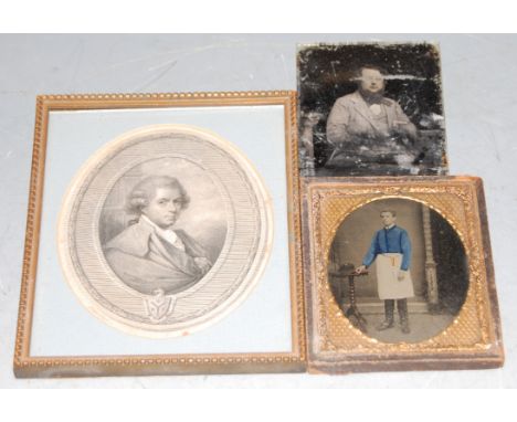 A Victorian overpainted daguerreotype of a gentleman in standing pose together with one other photo on glass and portrait pri