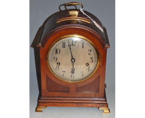 A circa 1900 mahogany cased dome topped bracket clock having silvered dial with Arabic numerals and eight day movement striki