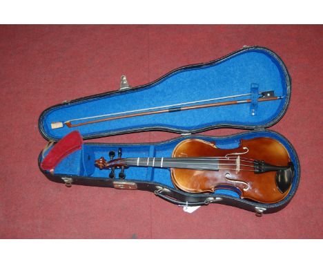 A 20th century Continental violin, having ebony fingerboard and two-piece back, bearing label for Tatra by Rossetti Stradivar