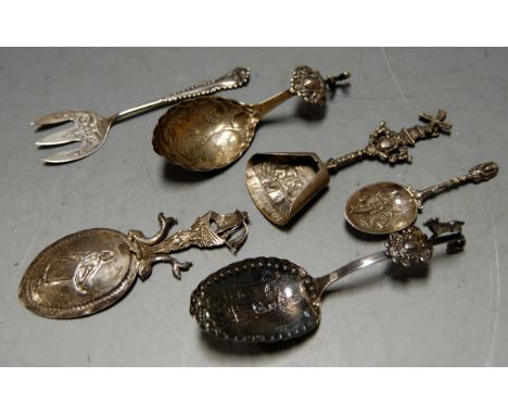 An early 20th century Dutch silver spoon the bowl embossed with female figure within landscape, the terminal surmounted by a 
