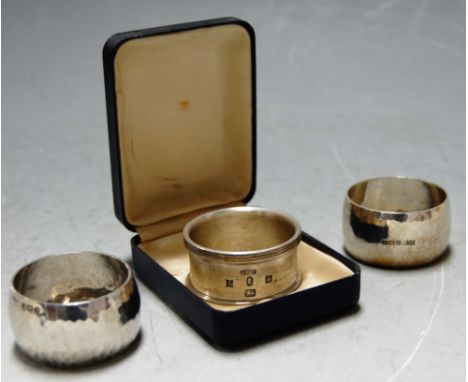 A 1978 British Engine Centenary silver napkin ring cased with booklet together with two other silver napkin rings (3)