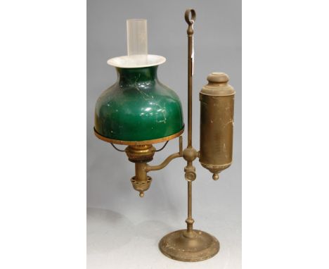 An adjustable desk lamp having an opalescent green glass shade