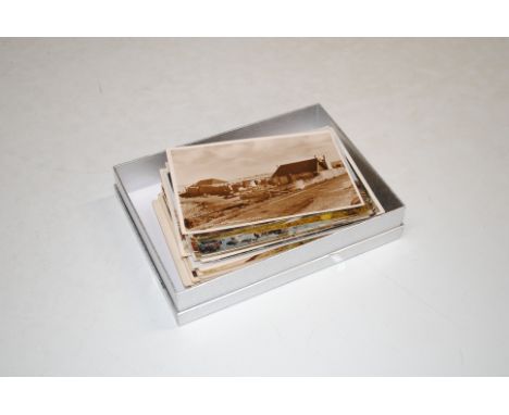 A box of vintage and other postcards