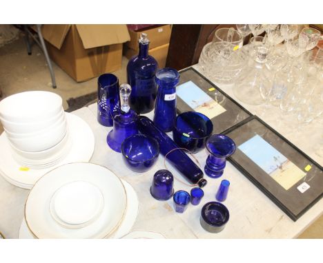 A collection of blue glassware; to include a love token rolling pin, vases etc.