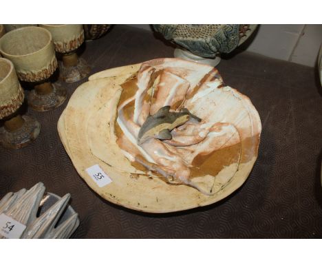 A Bernard Rooke pottery dish decorated with a Dolphin 