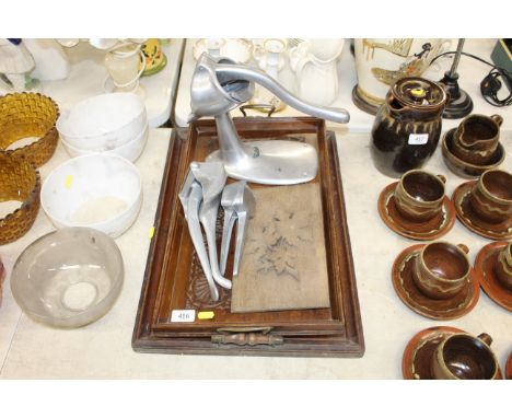 A vintage press; together with two 19th Century twin handled trays and a wooden panel