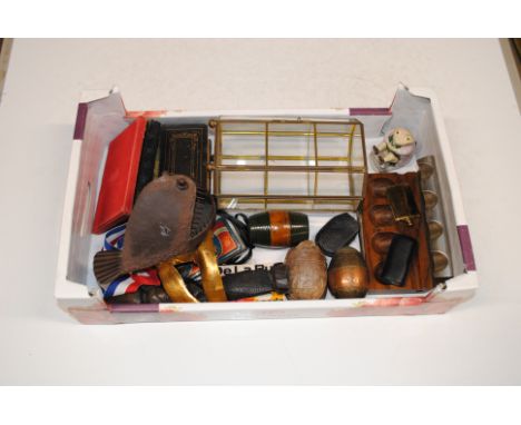 A box containing a Royal Albert Beatrix Potter model 'Mr Jackson'; a pipe rest; carved wooden figures; various books; a small
