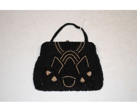 A beadwork and seed pearl decorated purse