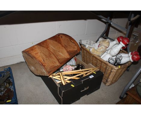 A box and a wicker basket with contents of a pair of turned wooden candlesticks, a pine corner unit, table easels, teddy bear
