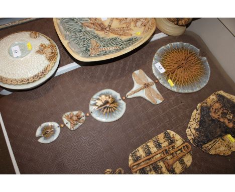 A Bernard Rooke pottery hanging decoration in the form of lily pads, dragonfly and frog AF