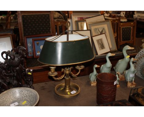 A brass twin branch table lamp and shade