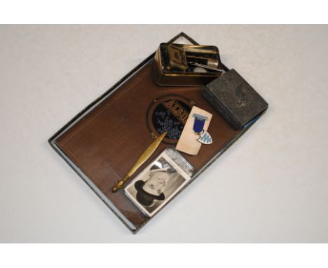 A photograph album and part contents; other ephemera; a trinket box and a tin containing mother of pearl penknife; white meta