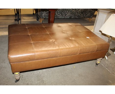 A Neptune button down leather stool