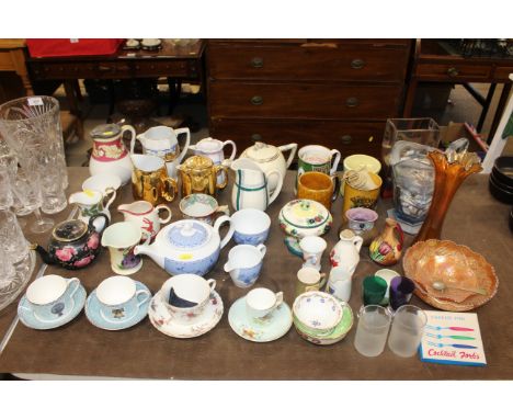 A collection of decorative china to include various teapots; jugs; cups; saucers; a collection of Carnival glass etc.