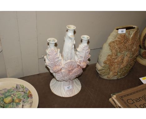 A Bernard Rooke pottery three branch candelabra decorated with snails and a butterfly