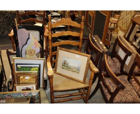 A string seated ladder back rocking chair