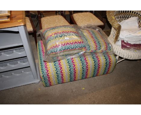 An Aztec design footstool and matching cushions